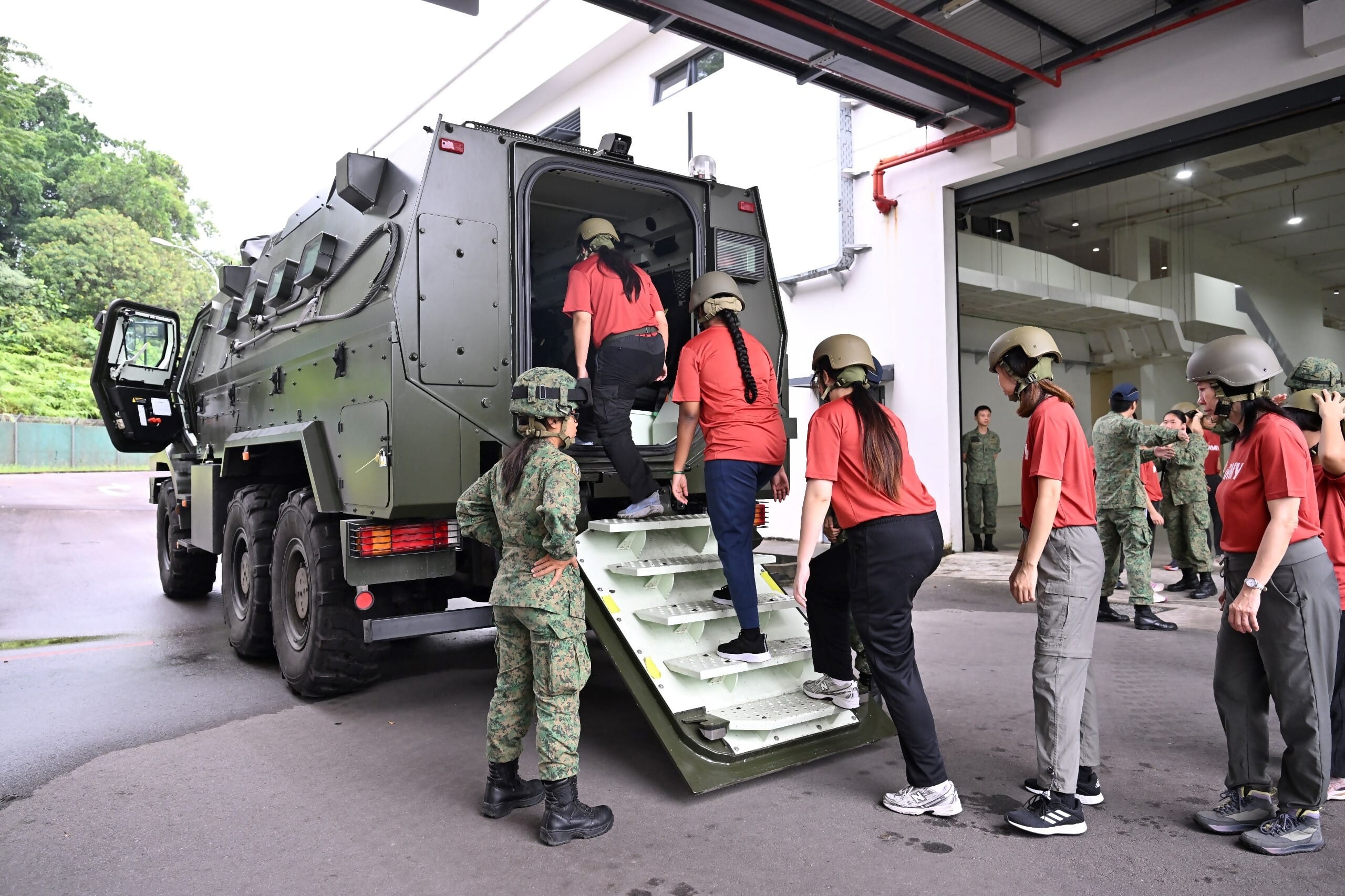 WBC25 participants going on-board the Army Peacekeeper Protected Response Vehicle (PRV) for an experiential ride.